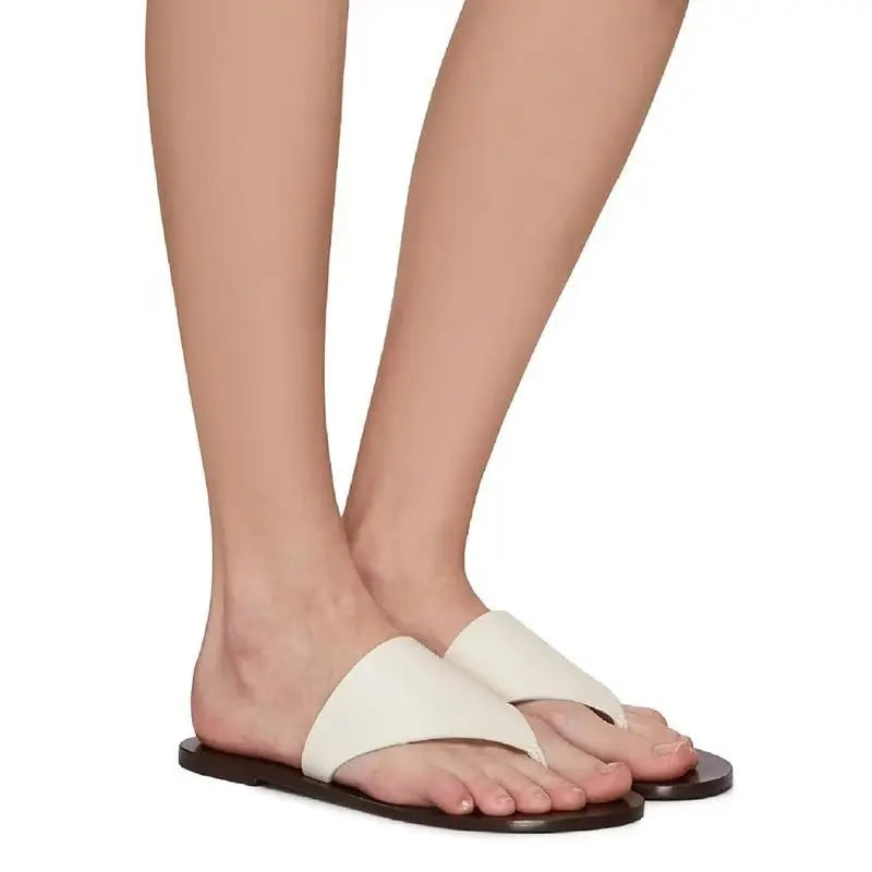 White SHOPEZRA L.L.C. women's flat thong sandals, outdoor summer Roman beach slippers with open-toe design.