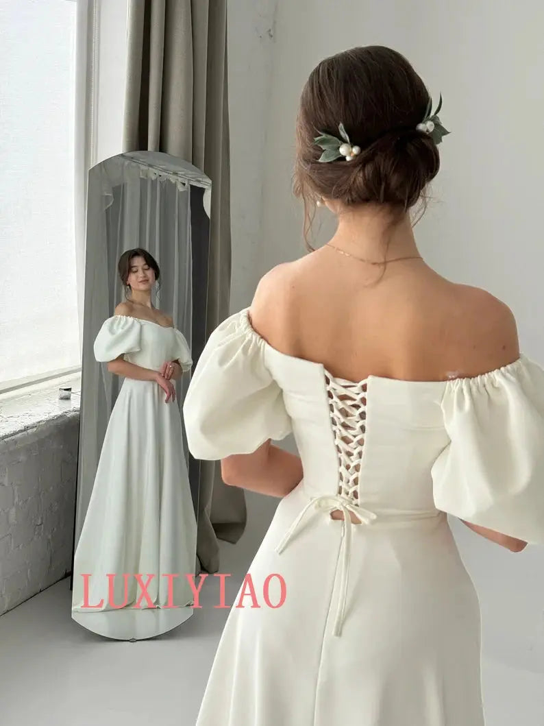 Elegant white ivory wedding dress with sleeves, fairy tale style, fitted silhouette, from SHOPEZRA L.L.C.