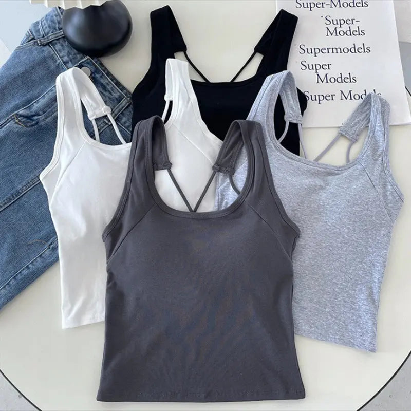 White all-in-one backless underwear for women with inner camisole and breast pads, designed to expose the back and be worn outside.