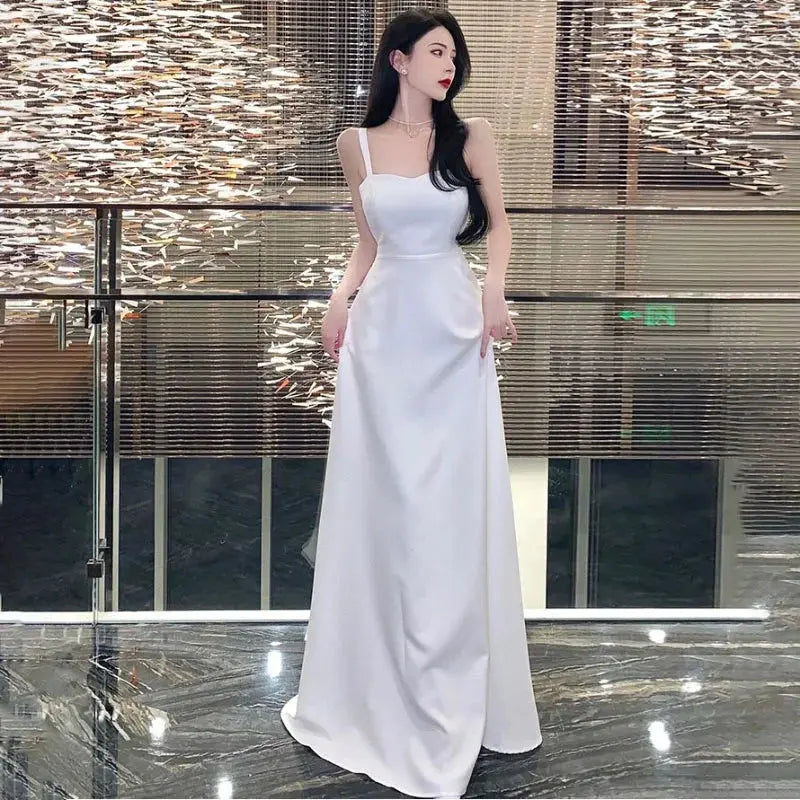 Elegant white women's evening dress by SHOPEZRA L.L.C., long summer sling dress suitable for banquets and travel.