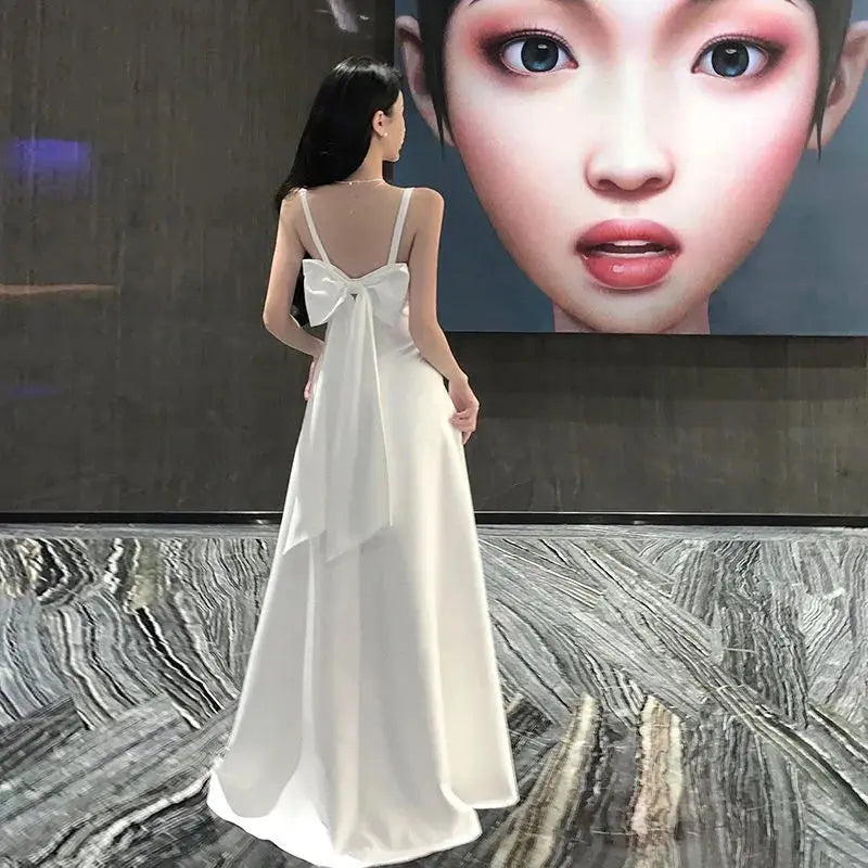 Elegant white women's evening dress by SHOPEZRA L.L.C., long summer sling dress suitable for banquets and travel.