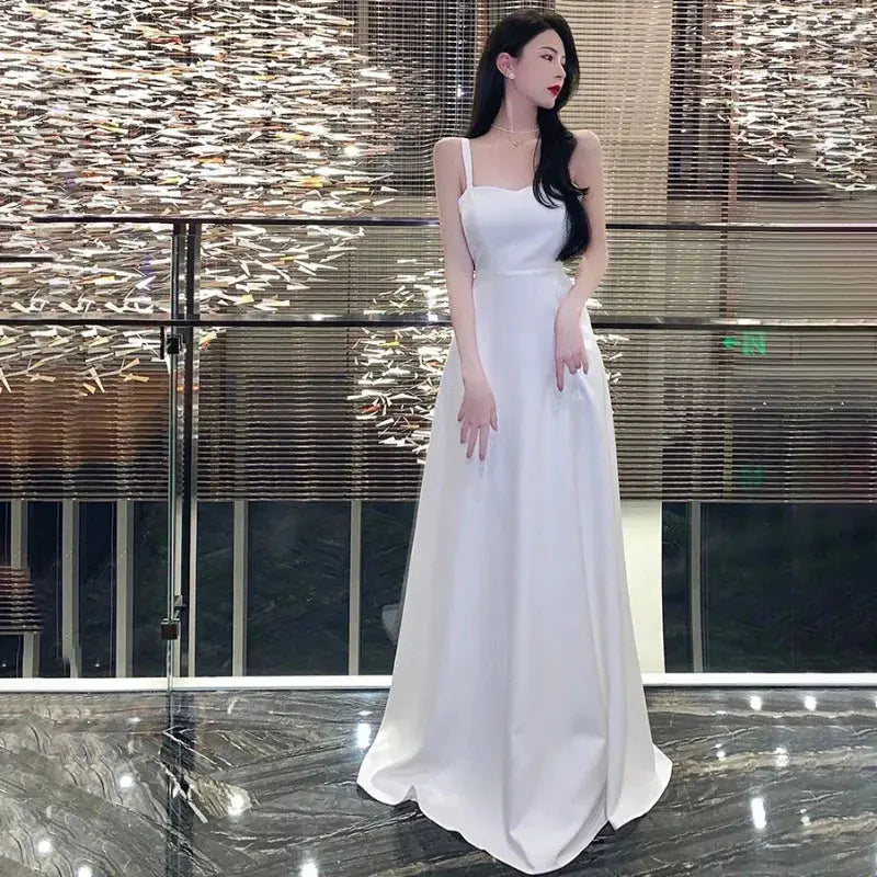 White women's chic evening dress by SHOPEZRA L.L.C., elegant long sling dress for banquets, travel, and summer occasions.
