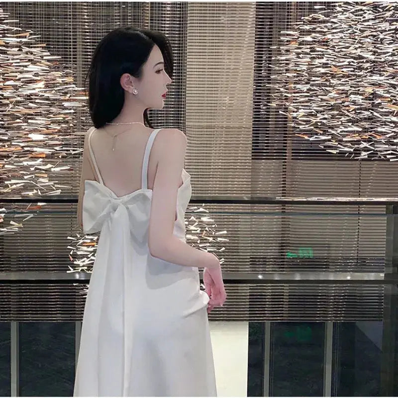Elegant white women's evening dress by SHOPEZRA L.L.C., long sling style perfect for banquets, travel, and summer occasions.