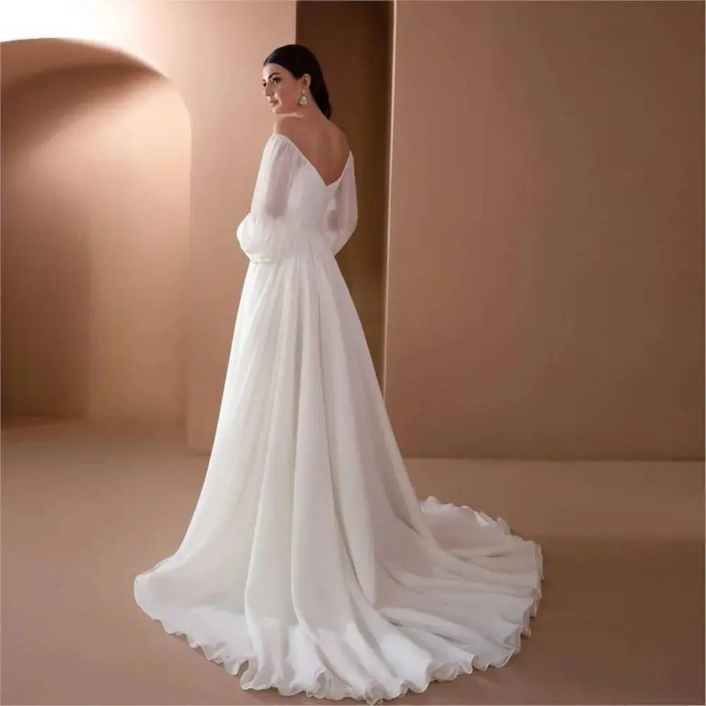 Elegant white women's evening dress by SHOPEZRA L.L.C. with long sleeves, one-line neckline, slim fit, and simple style.