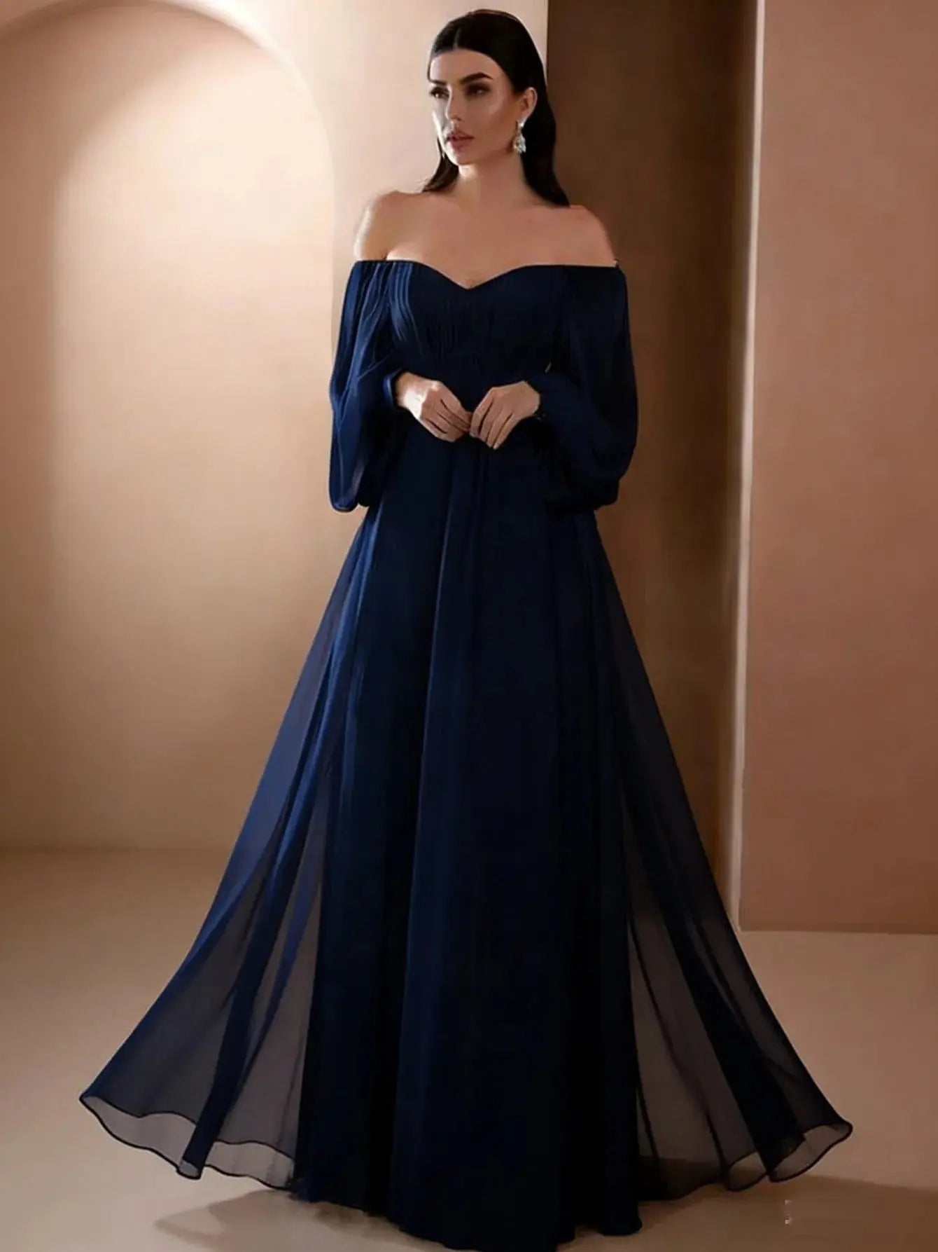 Elegant white women's evening dress by SHOPEZRA L.L.C. with long sleeves, one-line neckline, slim fit, and simple style.