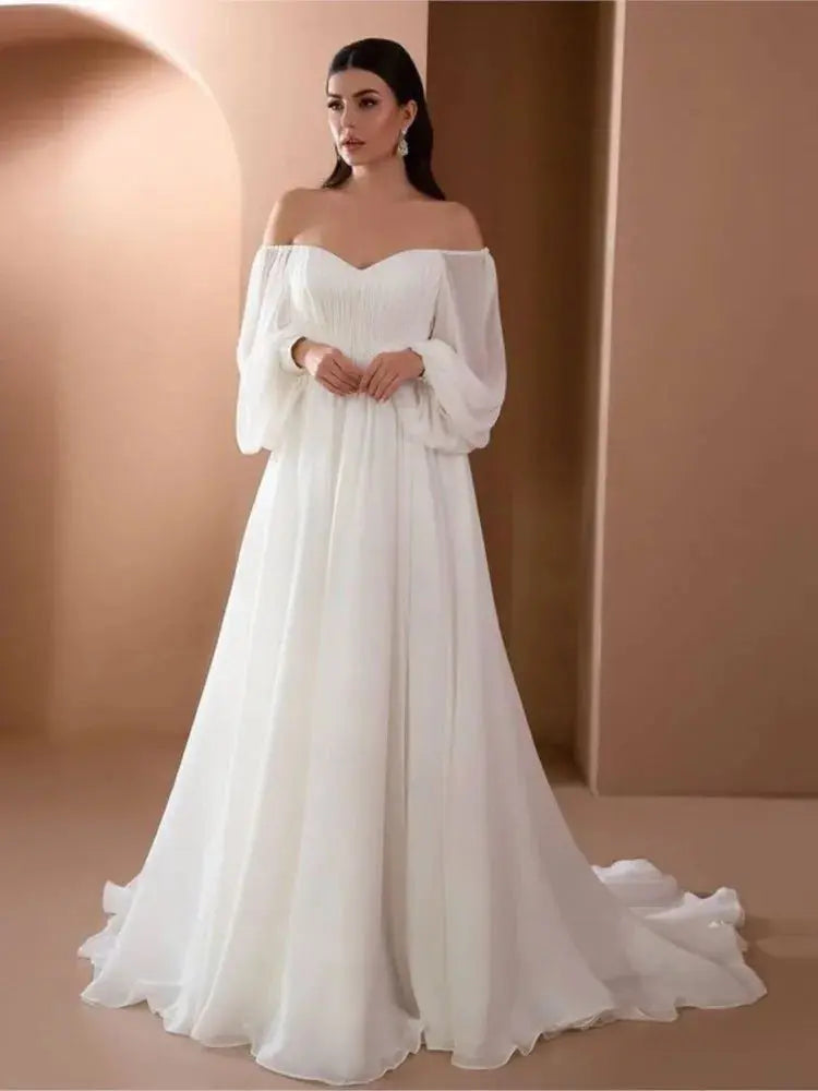 Elegant white women's evening dress with long sleeves, slim fit, one-line neckline, simple style, and solid color by SHOPEZRA L.L.C.