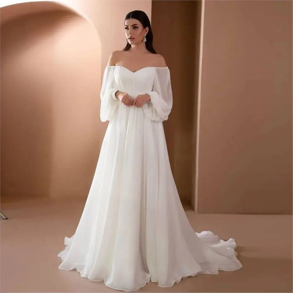 Elegant white women's evening dress by SHOPEZRA L.L.C. with long sleeves, slim fit, one-line neckline, and simple style.