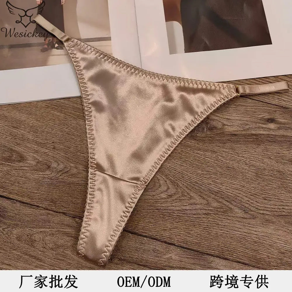 White women's thong underwear with leopard print, satin seamless design, cotton crotch, breathable, low waist for comfortable fit.
