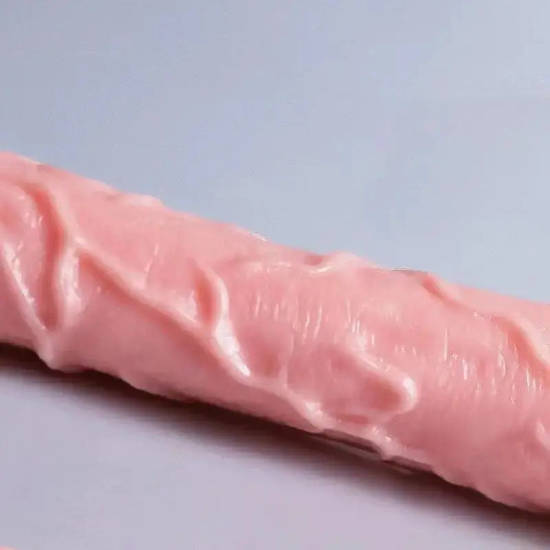 Realistic dildo sex toy with skin-like texture, large size, suction cup base, designed for women’s masturbation and anal play.