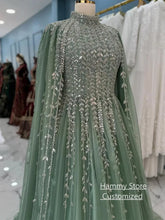Yellow Saudi Arabian evening dress by SHOPEZRA L.L.C., customized modest high neck gown with long sleeves and sparkling sequins.