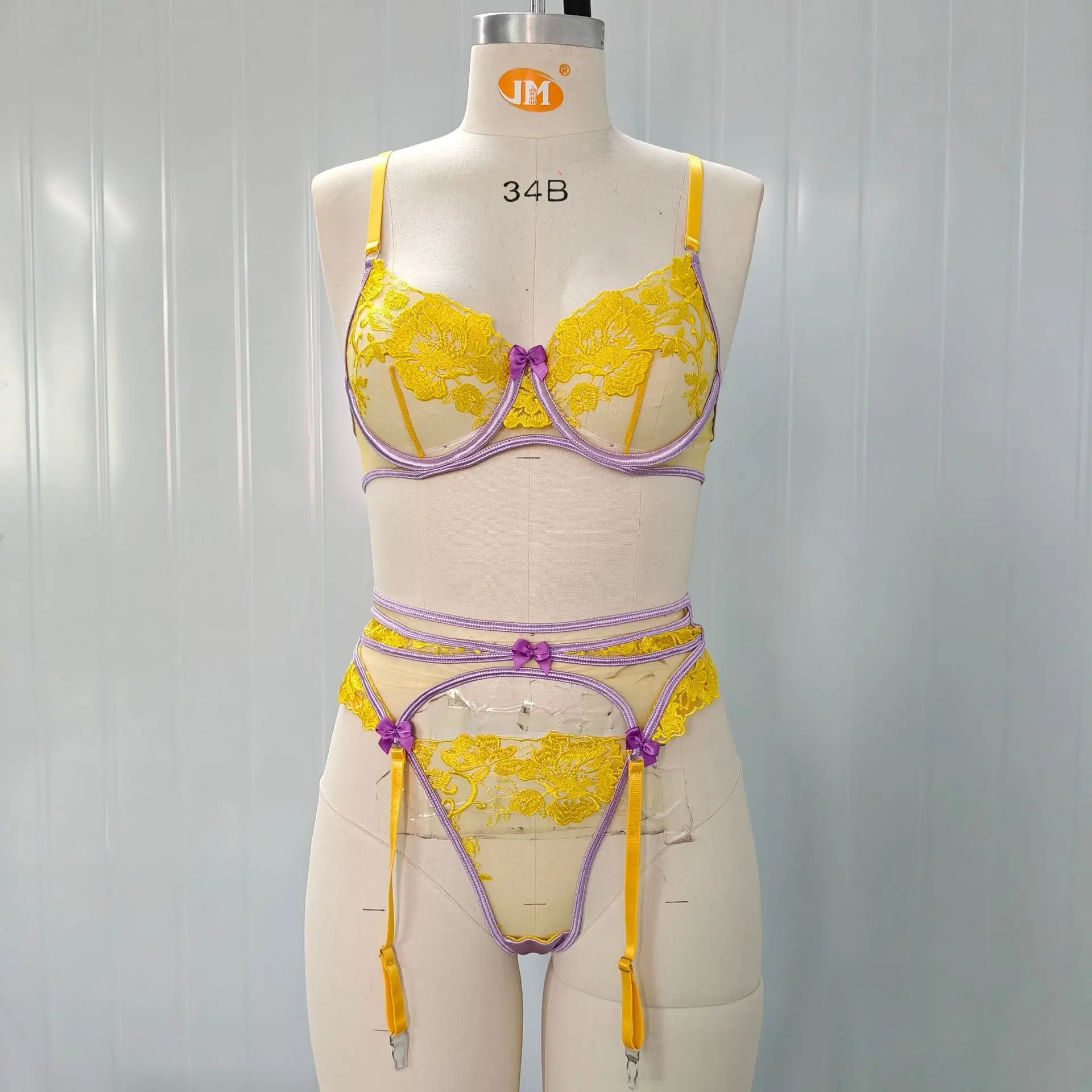 Yellow embroidered women's bra and underwear set with see-through fabric, floral details, and bow accents by SHOPEZRA L.L.C.