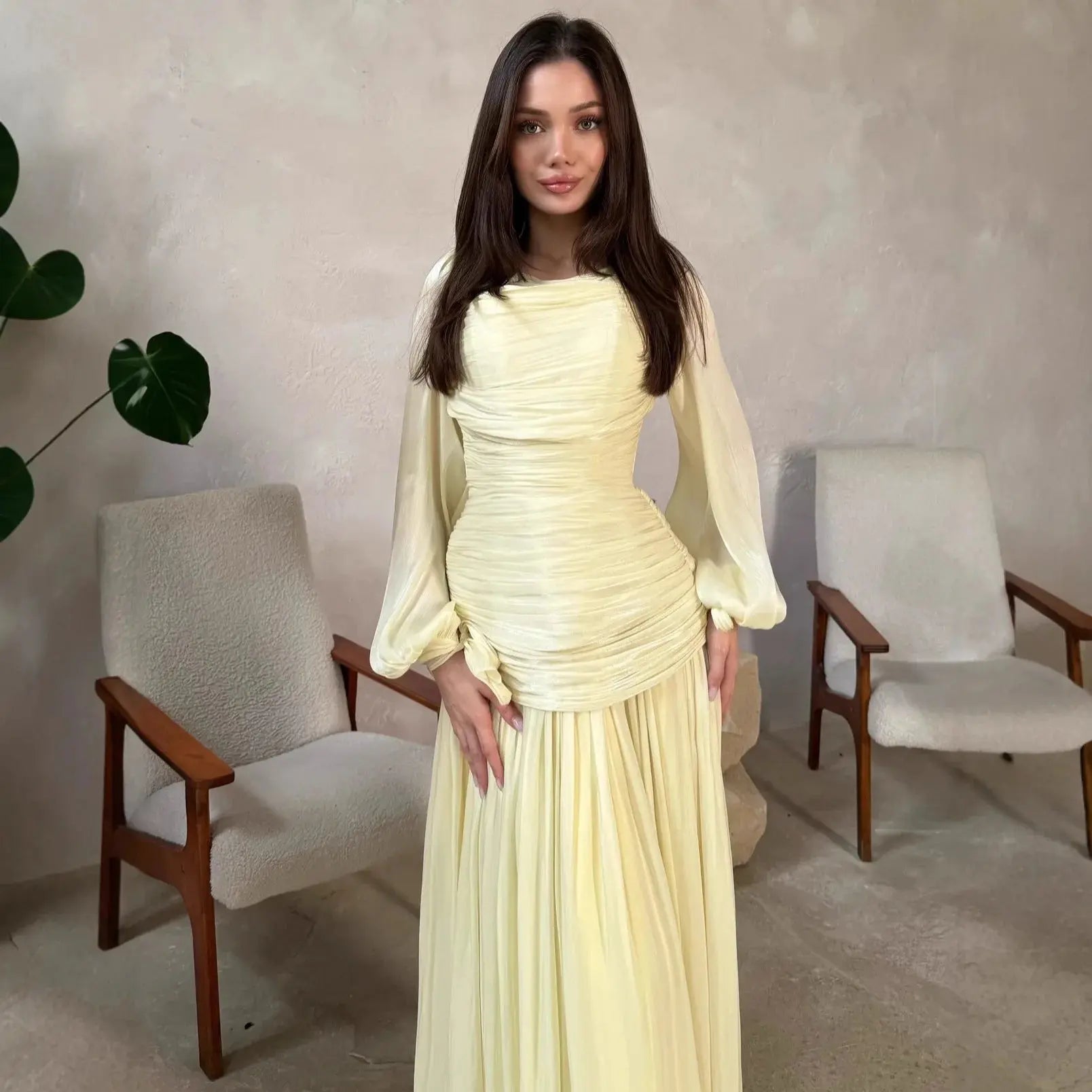 Yellow women's Eid Muslim abaya dress with folds, maxi gown style, long Dubai kaftan design, suitable for Ramadan and festive occasions.