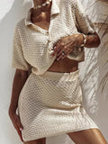 Openwork sweater set for women featuring a button-up top and a matching skirt in a light beige color.