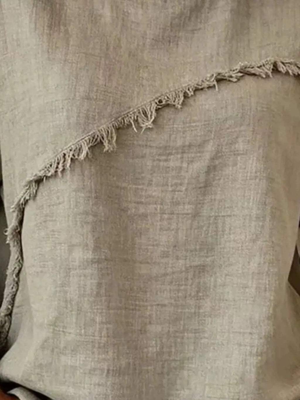plus size frayed hem top featuring a textured fabric and unique frayed hemline detail, perfect for casual wear.