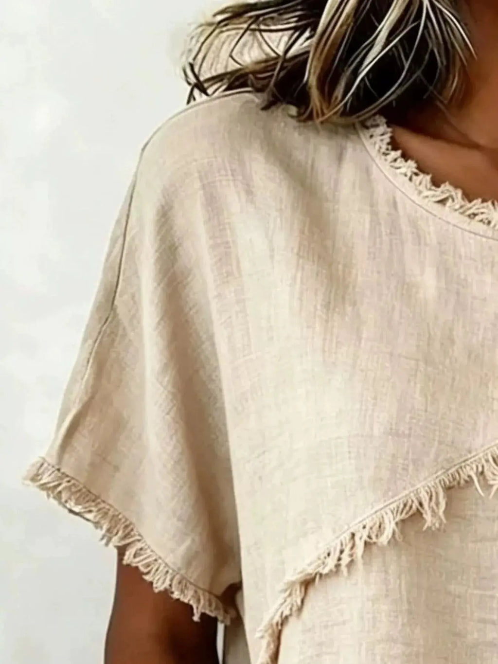 Plus size frayed hem top featuring a unique frayed hemline and short sleeves, perfect for casual wear.